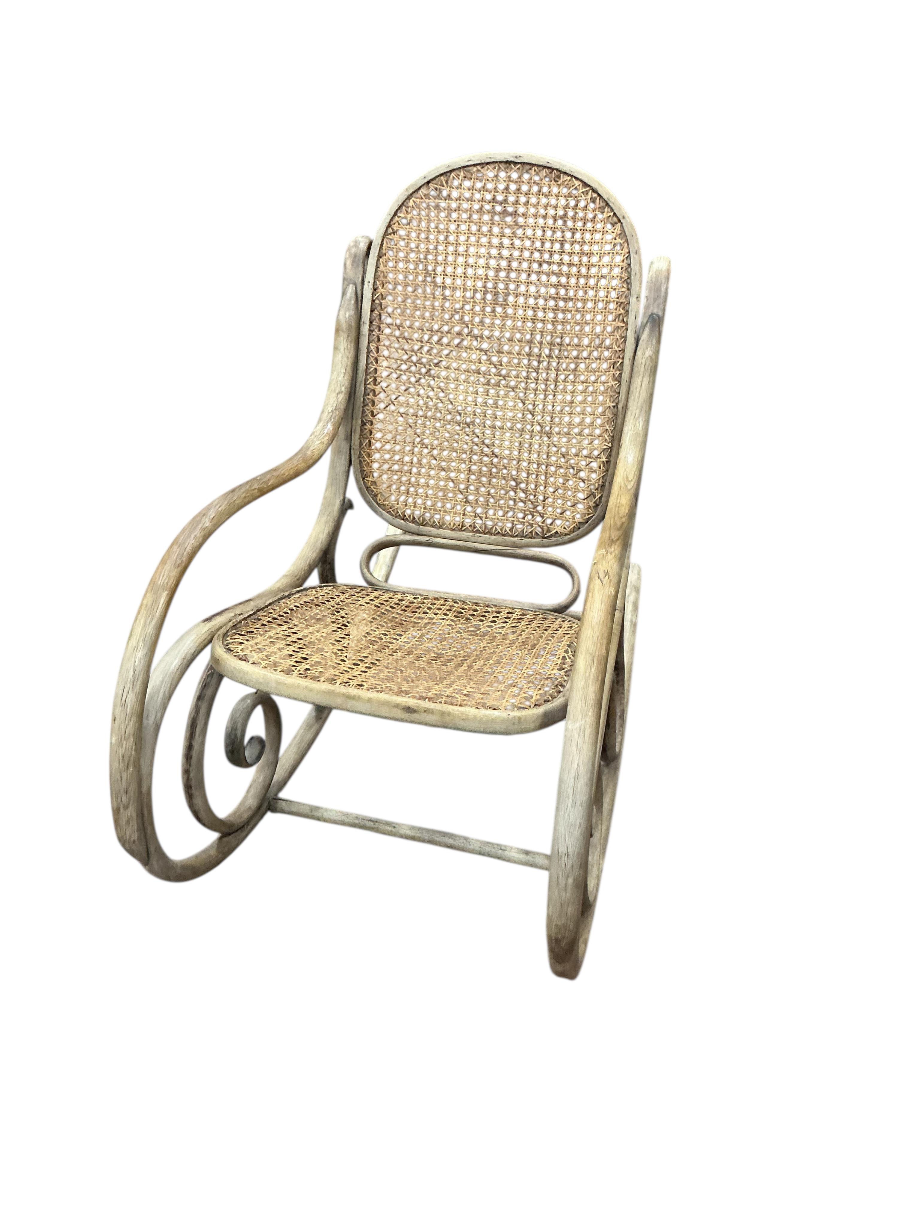 In the style of Tito Agnoli: A bamboo armchair and a bentwood rocking chair, larger width 62cm, depth 63cm, height 108cm